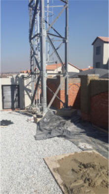 Narrow based parallel towers for erection in confined spaces.